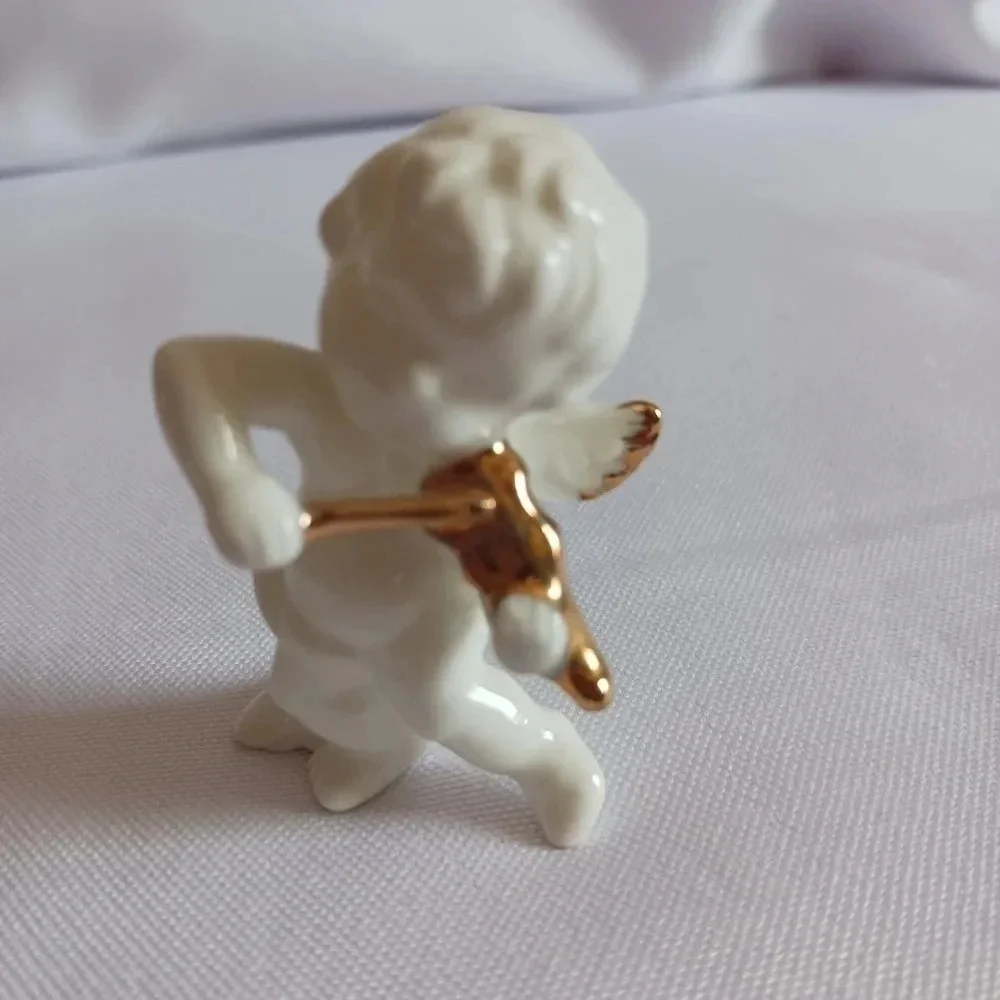 Bone china set of 4 angels gathered playing instruments